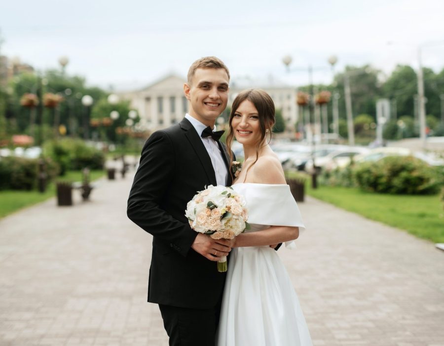 young-couple-bride-and-groom-in-a-white-short-dress-3-e1659371532669.jpg