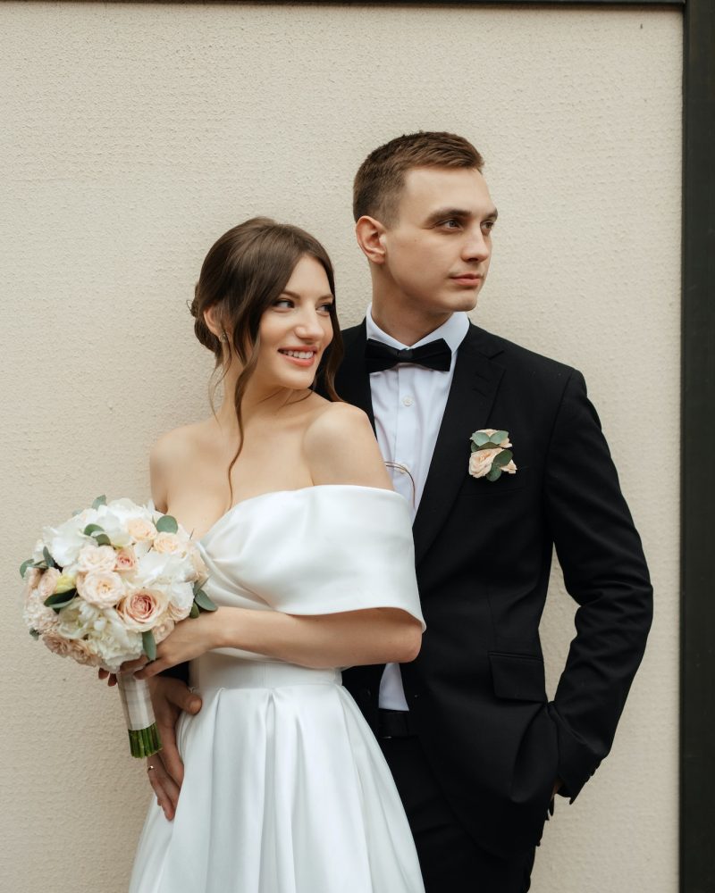 young-couple-bride-and-groom-in-a-white-short-dress.jpg