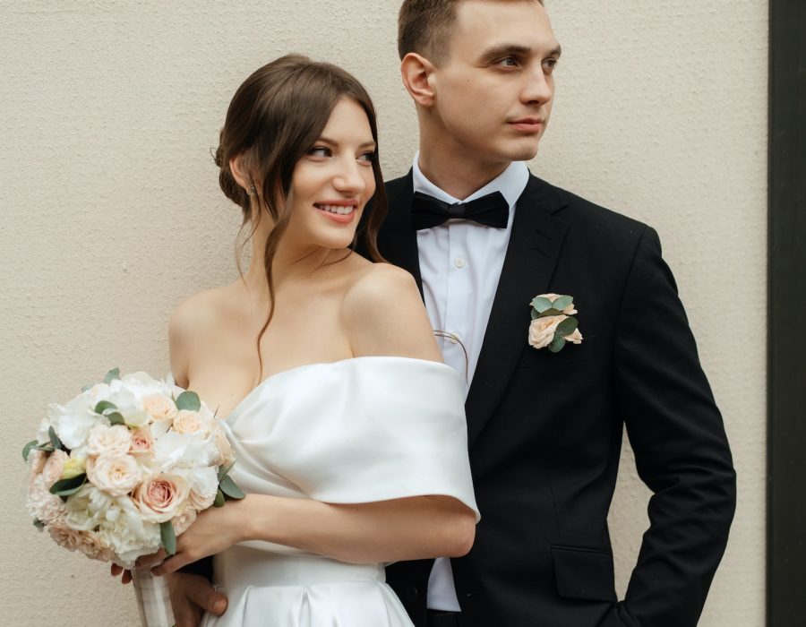 young-couple-bride-and-groom-in-a-white-short-dress.jpg